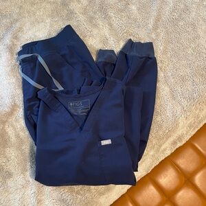 Navy blue Catarina scrub top and Zamora jogger pants